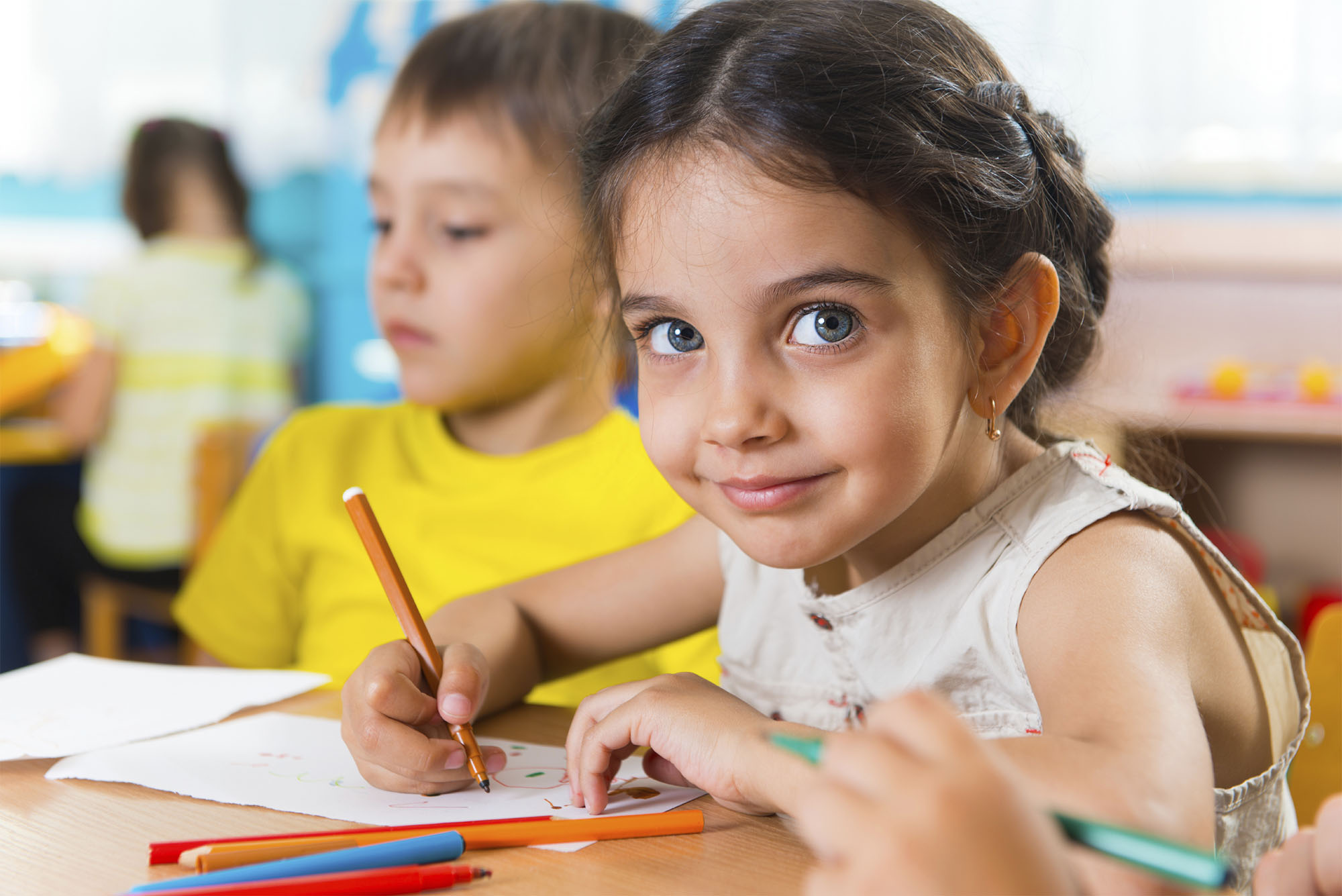 Group of cute little prescool kids drawing